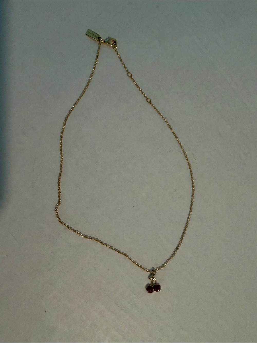 Coach Gold-Tone Necklace with Red Cherry Pendant